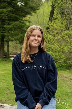 young woman in front of green background